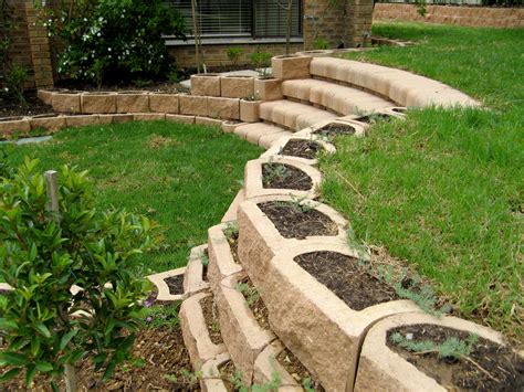 Curved stairs with retaining blocks - Terraforce | Landscaping a slope ...