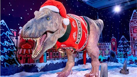 T. rex models Christmas jumper at London's Natural History Museum - BBC News