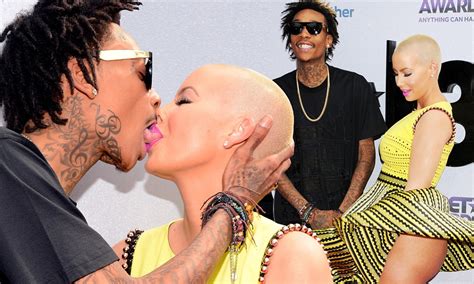 BET Awards 2013: Amber Rose's billowing dress reveals her bare derrière as she shares a VERY ...