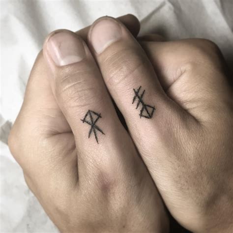 Runes on fingers - Tattoogrid.net