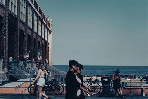 Walkers on Asbury Park Beach Boardwalk Photograph by Joshua Leeman | Fine Art America