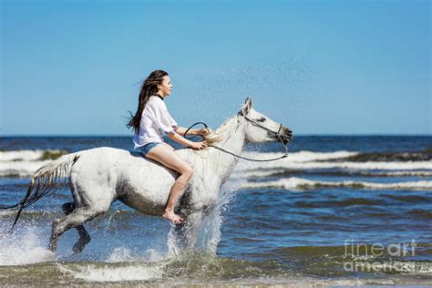 Young girl riding on the white horse through the ocean. Photograph by Michal Bednarek - Fine Art ...