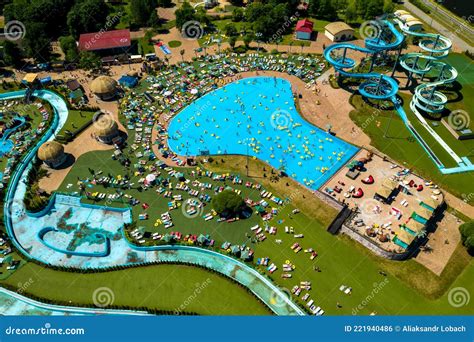 Top View of People Relaxing in the Pool on Yellow Inflatable Circles ...