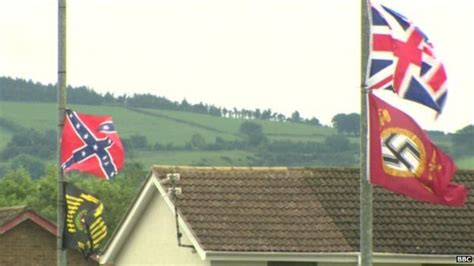 Nazi flags near Carrickfergus bonfire site taken down by "outraged" residents - BBC News