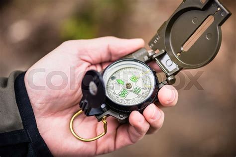 Hiker using compass | Stock image | Colourbox