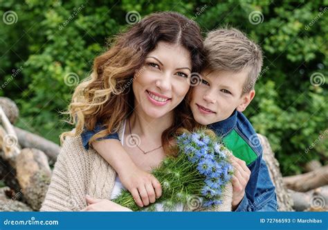 Little Boy with Flowers for Mom Stock Image - Image of happy, parent ...