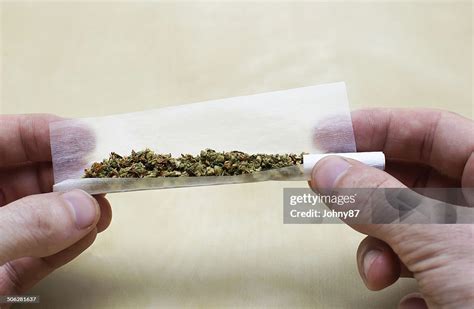 Rolling Marijuana Joint High-Res Stock Photo - Getty Images