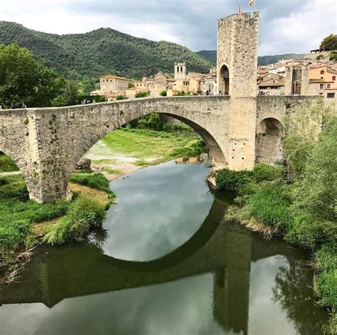 Exploring the medieval bridge in Besalú which remains me of my trip to ...