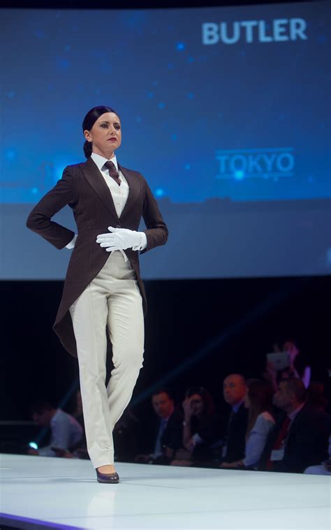 An Etihad Butler on the runway, showcasing our amazing new uniform. www ...