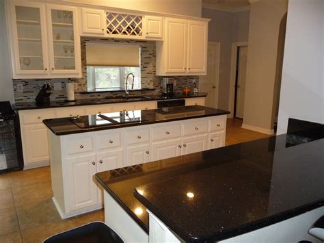 Black Galaxy Granite Countertops with White Painted Cabinets | White cabinets white countertops ...