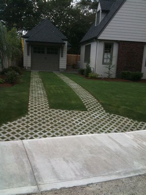 Ribbon driveway and turf stone | Driveway design, Home landscaping, Driveway landscaping