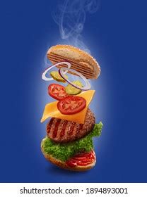 Burger Flying Ingredients On Blue Background Stock Photo 1894893001 | Shutterstock