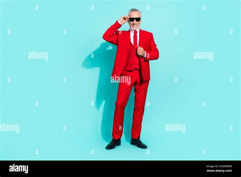 Photo of pretty retired man wear red three piece suit arm dark eyewear ...