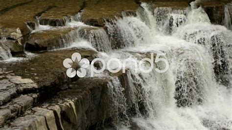 the water is flowing over the rocks and into the river to see what looks like it's coming out