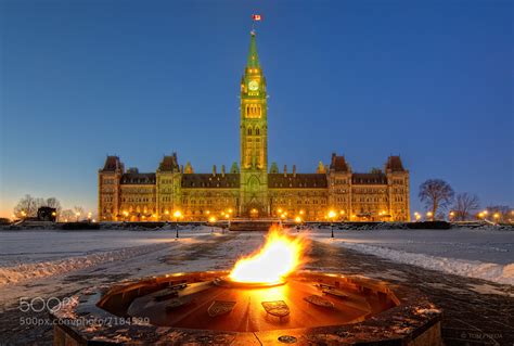 Photograph Parliament Hill & The Centennial Flame in mid-winter by Tom Freda on 500px