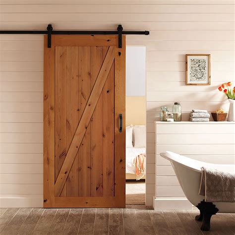 Masonite 42-inch x 84-inch Z-Bar Knotty Alder Solid Core Barn Door with Sliding Door Hardw ...