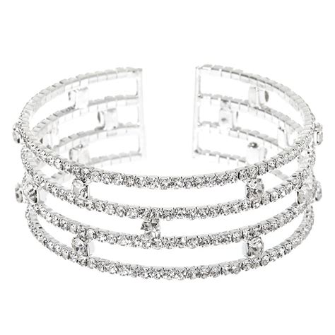 Stack on the glam with this four row cuff bracelet! This silver-tone ...