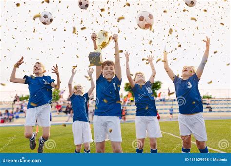 Happy Boys Celebrating Soccer Championship. Youth Football Winning Team Jumping and Rising ...