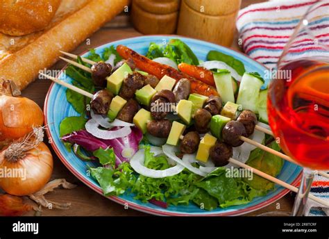 Chicken hearts skewers with avocado Stock Photo - Alamy