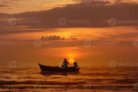 Silhouette fishing boat at sea sunset background. 714522 Stock Photo at Vecteezy