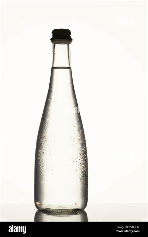 Filled glass bottle with clear water Stock Photo - Alamy