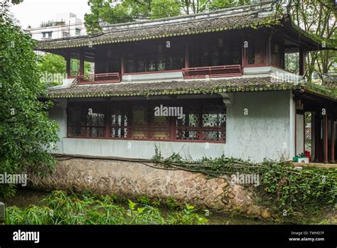 Traditional Chinese style old houses along a creeks in a park in ...