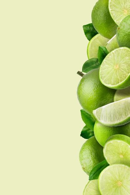 Premium Photo | Lime fruit and Lime slices on green pattern background