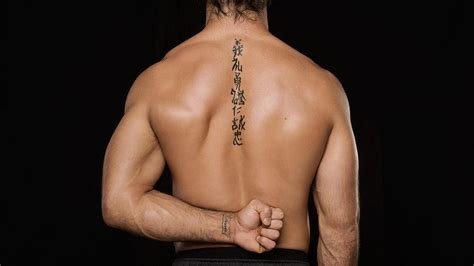 Photos: See the tattoos of Superstars like Roman Reigns, Seth Rollins ...