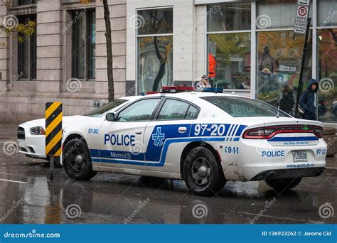 Two Montreal Police Service SPVM Cars Standing In Front Of A Local Police Station. The SPVM Is ...