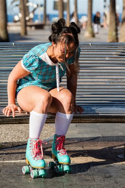 Image of woman on roller skates - Austockphoto