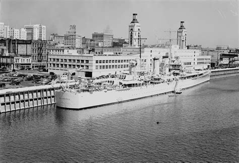 Brooklyn-class cruiser light cruiser USS Philadelphia (CL-41) tied up along the seawall front of ...