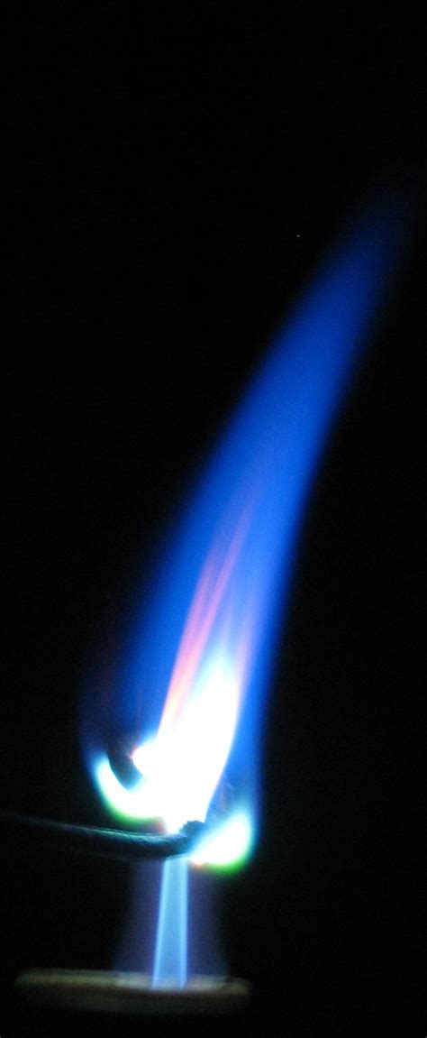 A very hot, butane flame is colored a bright blue by Copper(II ...