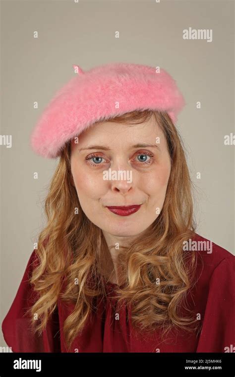Beautiful blonde hair girl with pink fluffy beret hat Stock Photo - Alamy