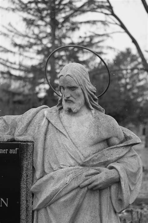 Statue of Jesus Christ on a Grave · Free Stock Photo