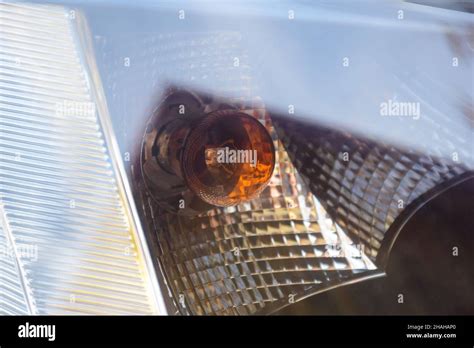 Car headlight of a modern car close up with bulbs seen through glass Stock Photo - Alamy