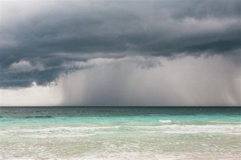 Rain Storm Over The Ocean And Beach Photograph by Sasha Weleber