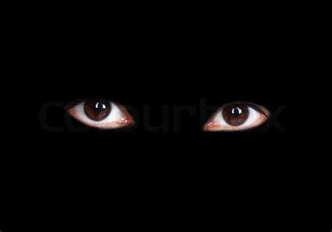 Eyes of a girl isolated on black ... | Stock image | Colourbox