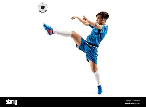 Young boy with soccer ball doing flying kick, isolated on white ...