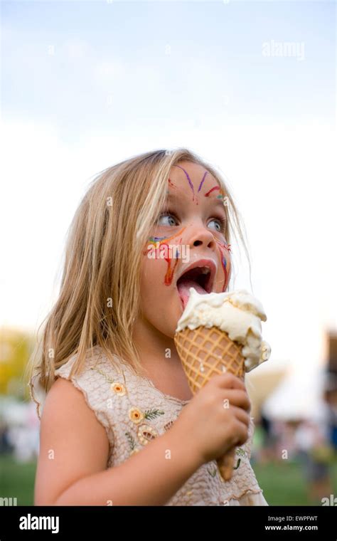 Girl licking ice cream hi-res stock photography and images - Alamy