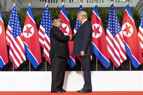 File:Kim and Trump shaking hands at the red carpet during the DPRK–USA Singapore Summit.jpg ...