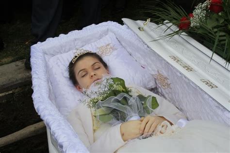 Andreea Brazovan in her open casket during her burial. in 2020