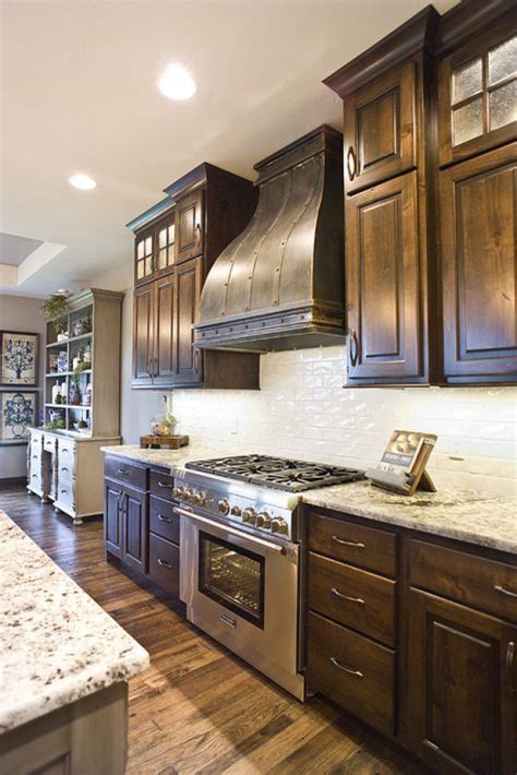 knotty alder custom cabinetry kitchen cabinets stacked cabinet doors reeded glass muntins mull ...