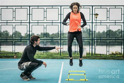 Hurdle Training With Personal Trainer Photograph by Microgen Images/science Photo Library - Fine ...