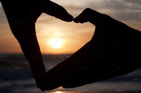 Hands forming a heart at the sunset featuring sunset, heart, and love | Nature Stock Photos ...