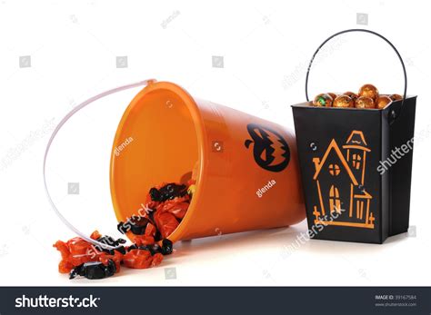 Two Halloween-Decorated Buckets Filled With Candy, One Tipped Over And Spilled. Isolated On ...