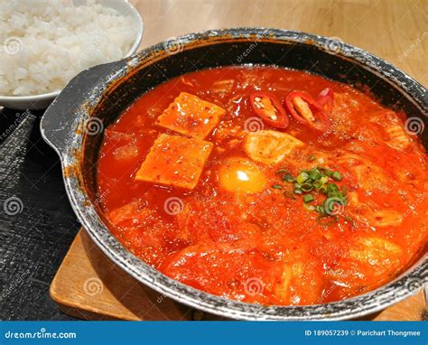 Korean Tofu Hot Spicy Soup in Hot Plate Pot with Rice on Background Delicious Food Business ...