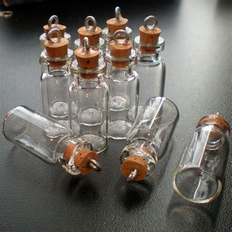 12 Small Glass Bottles with cork and loop. by BottlesNThings