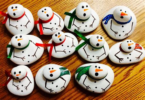 Melted snowmen painted rocks, scarves painted on or glue on a ribbon. Painted rocks by Holly N ...