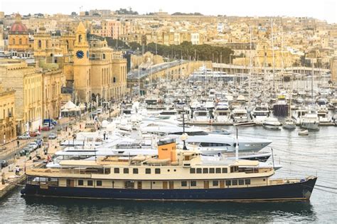 Premium Photo | The valletta port is a popular tourist attraction full of cafes and restaurants.