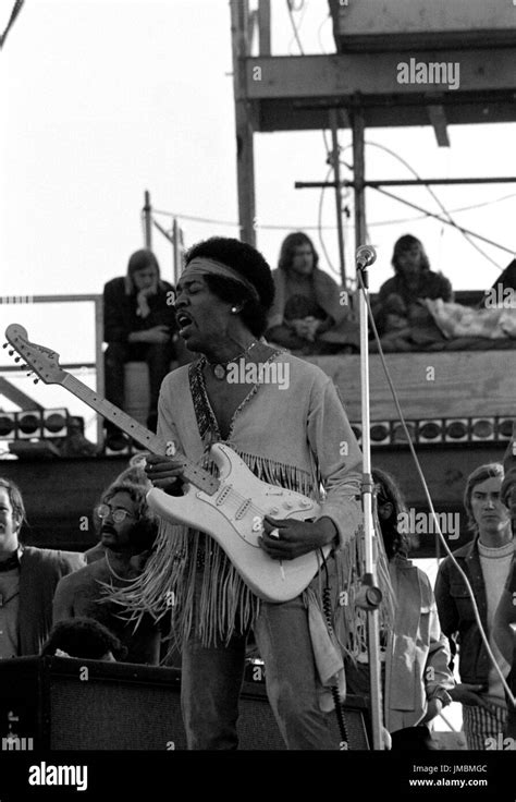 Jimi Hendrix performing his legendary 2 hour performance at Woodstock ...